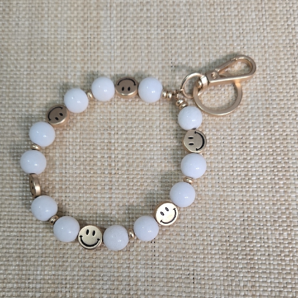 White and Gold Key Chain bag Charm with Smiley Accents